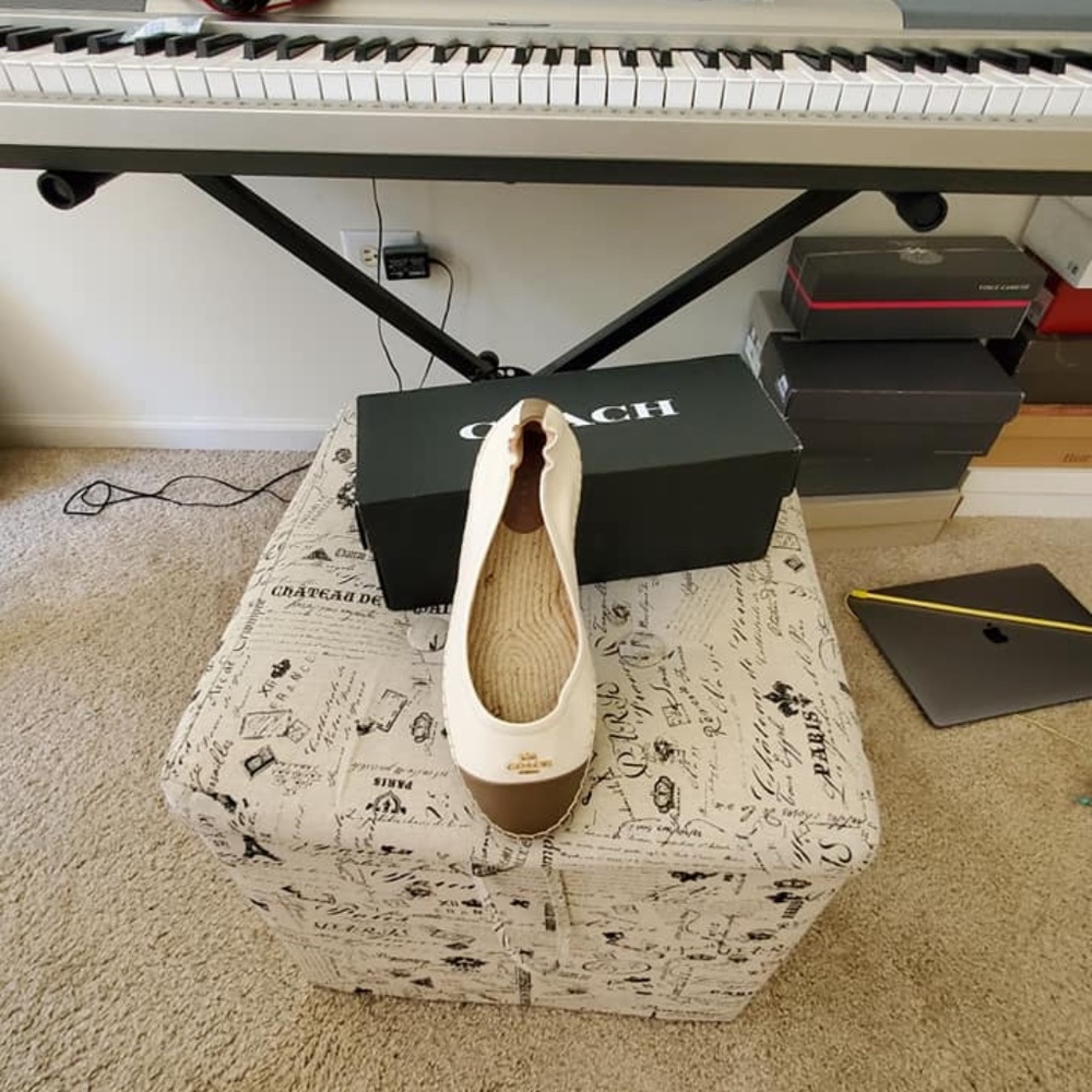 Light wearing shoes by Coach.